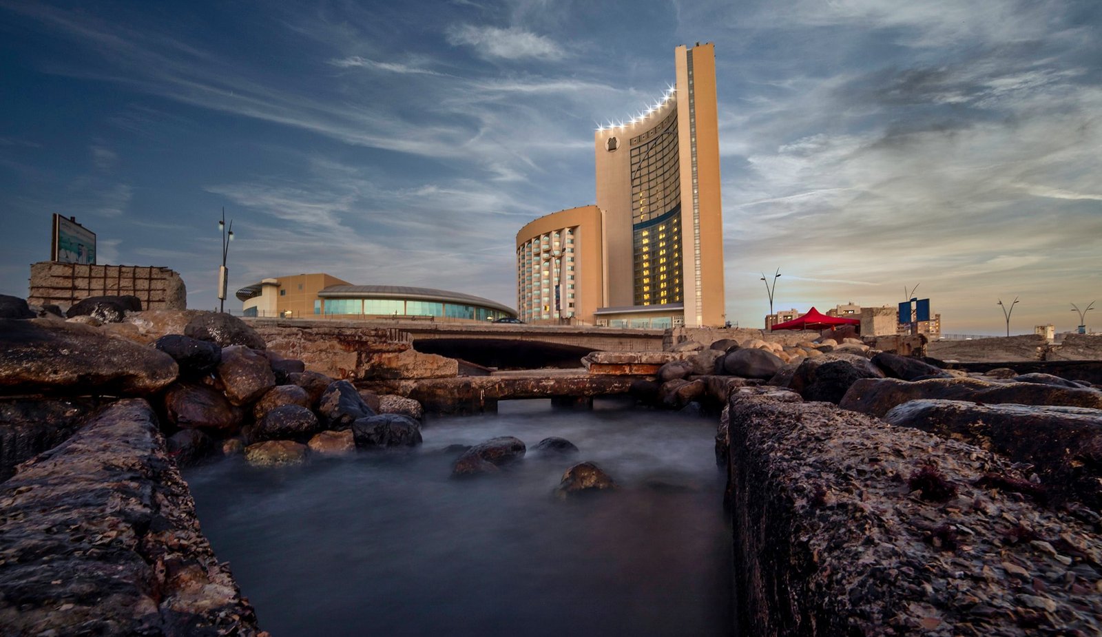 117037688 10207488777173907 2182382362745585575 o Libya Business Opportunities: Sectors & Market Entry Seafront high-rise building beside the rocky shoreline in Tripoli