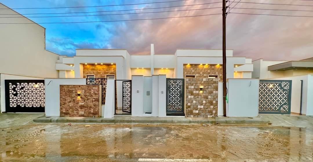Modern residential property in Libya with stone exterior and decorative gates