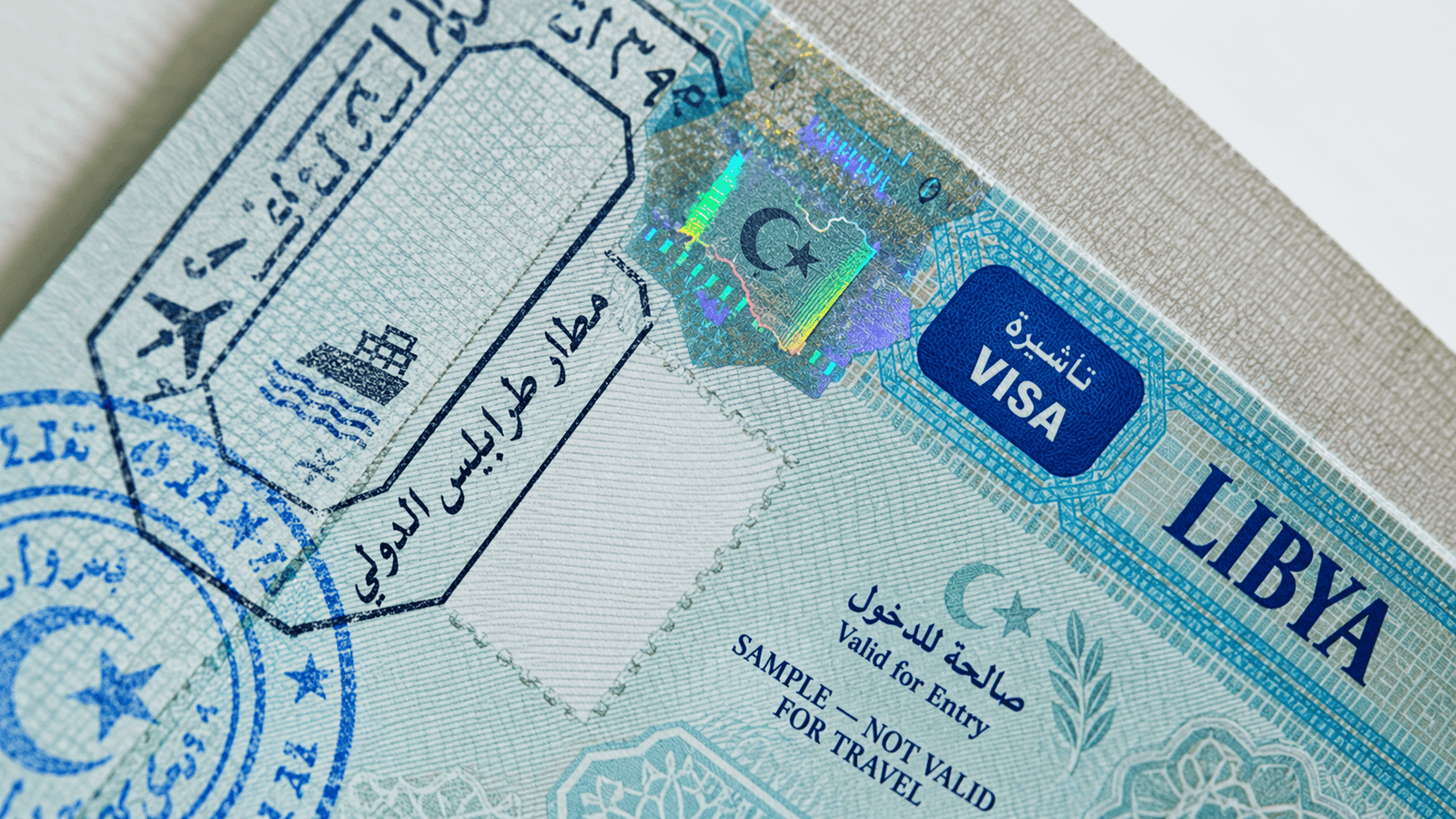 Illustrative Libya business visa sample in a passport, not a valid travel document